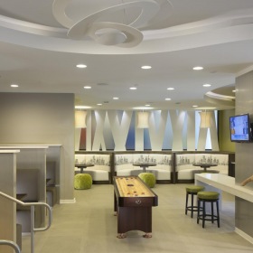Find your perfect fit at 1377 a room with a shuffleboard and chairs
