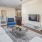 a living room with a rug and a couch