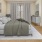 a bedroom with a bed and a fan