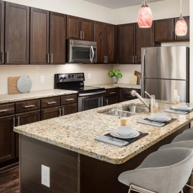 Spacious kitchens with thoughtful details a kitchen with a marble island