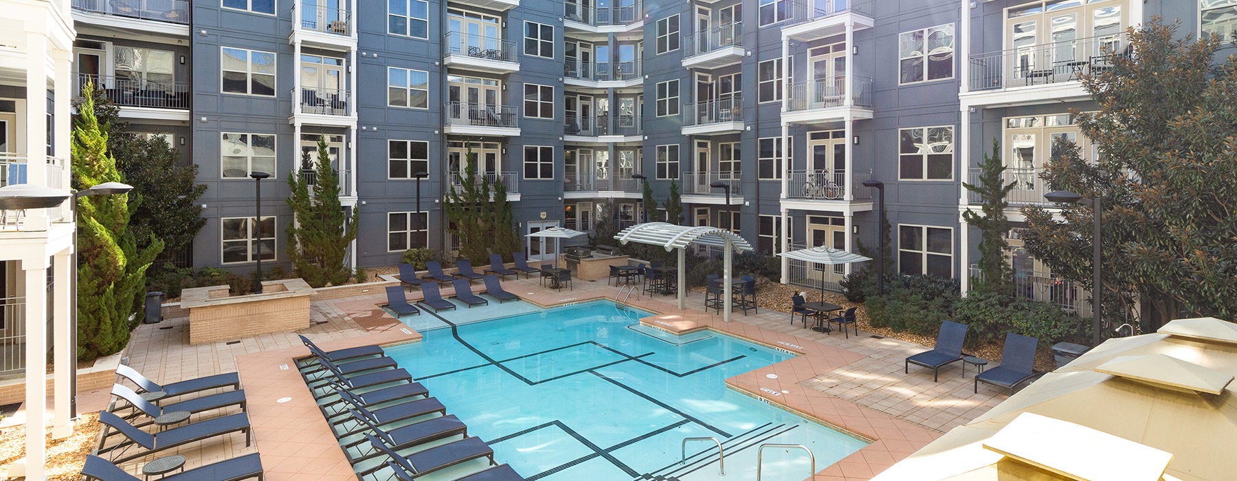 pool with chairs and umbrellas