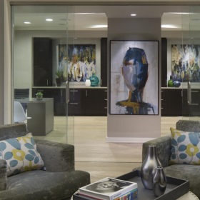 a lounge area with glass doors
